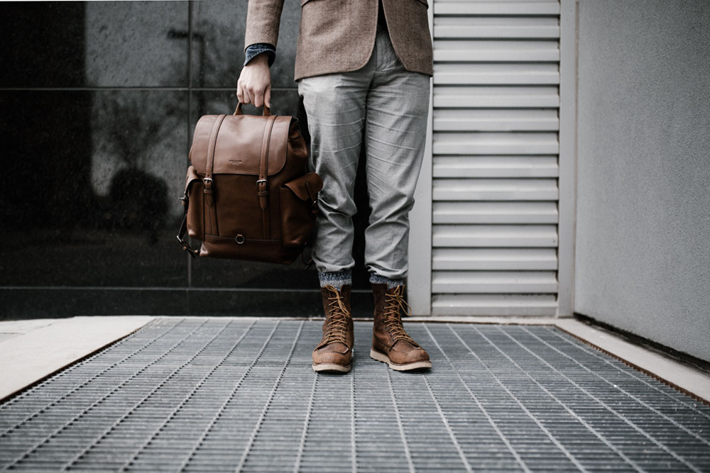 Man with brief case leaving the office early
