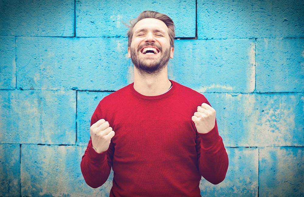 Very happy man in a red jersey