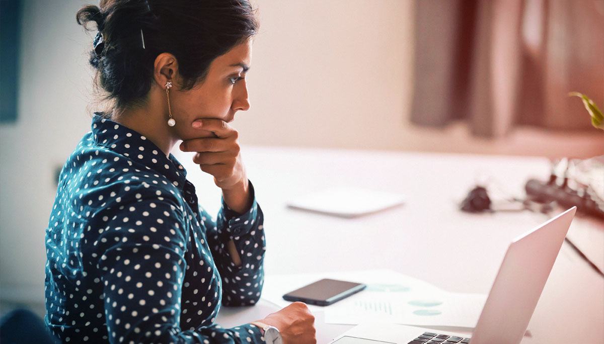Female CEO holding her chin while pondering her options