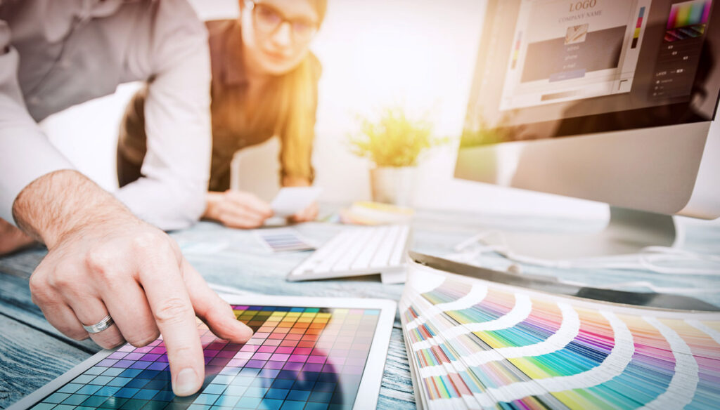 Creative employees discuss colour charts
