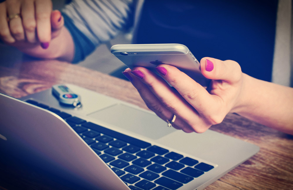 Closeup of woman being distracted by her iPhone