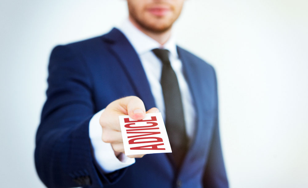 Man holding out an advice ticket Before you give out advice - do these 3 things