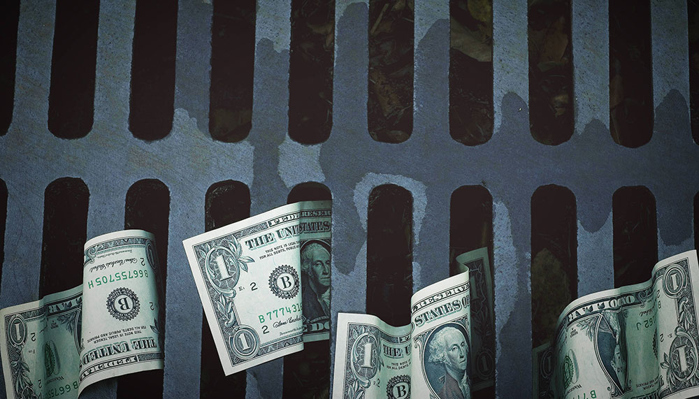 Dollar bills washing down the drain
